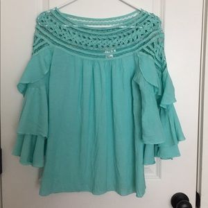 Women’s turquoise blouse with ruffle sleeve